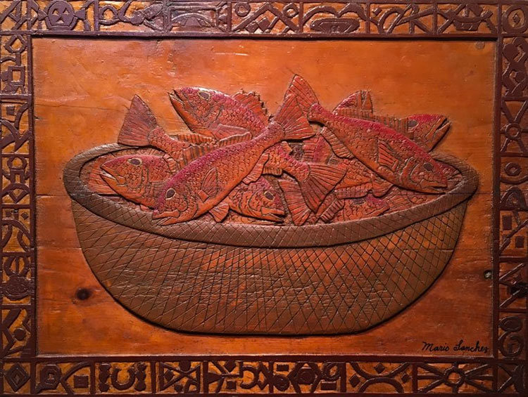 Artwork wood cut of fish in a bowl