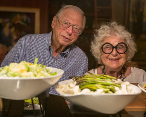 Stanley and Judith Zabar with a spread of food