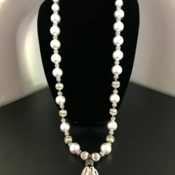 Long necklace made of pearl and silver beads with tiny strands of pearls hanging down