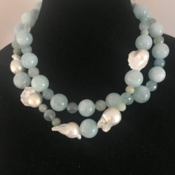 Two strands of round aquamarine beads with Baroque pearls