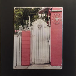 Photo: White gate between pink walls