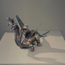 Chrome plated bronze, three headed dragon with large airplane wing extending from it's back