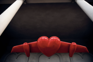 Red, glossy airplane with a heart as its body, hanging between two white pilars