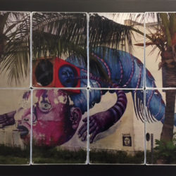 Photo collage of a mural painted on a wall in a tropical location with palm trees growing in front of it.