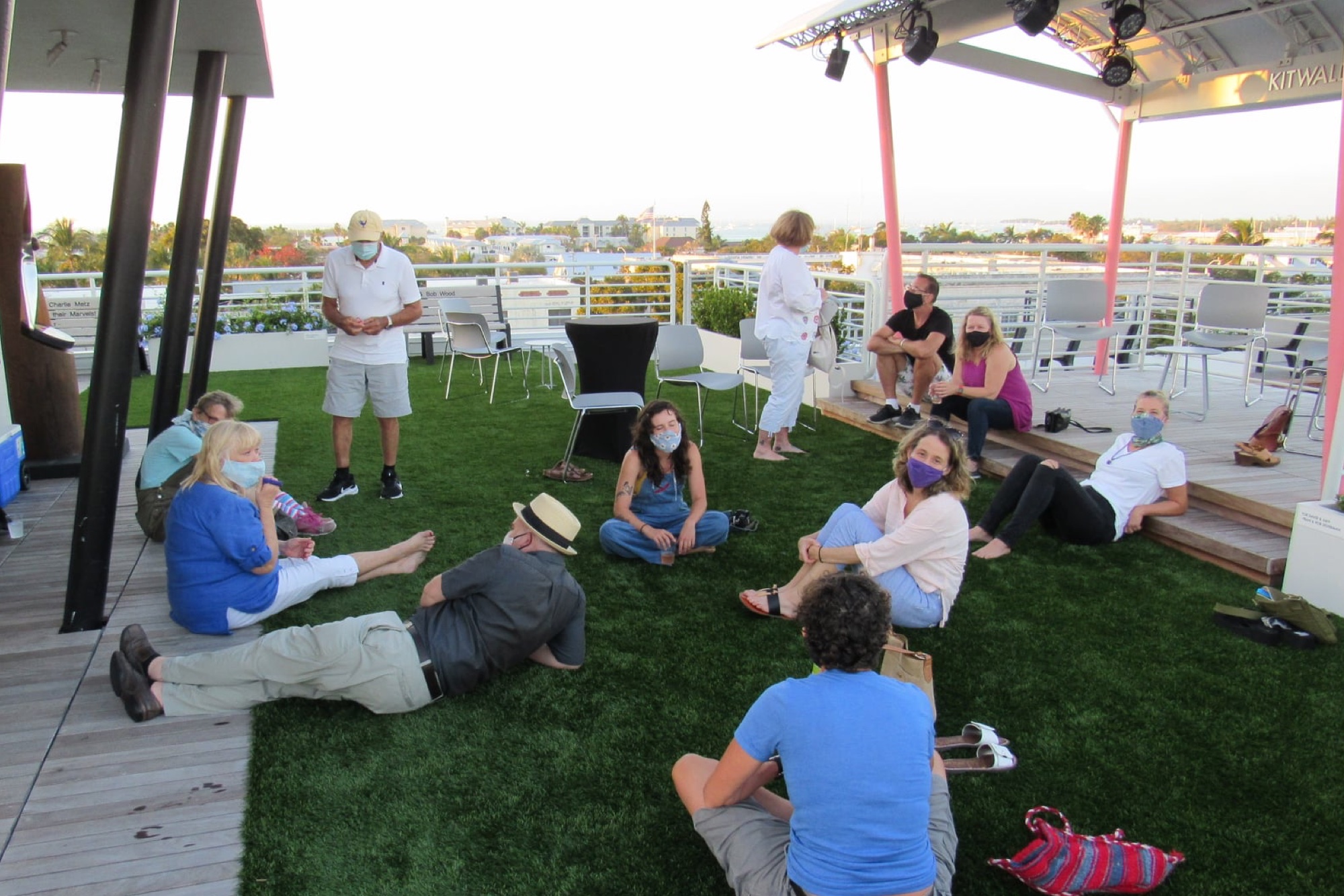 Artists, writers and staff gather on the rooftop overlooking Key West