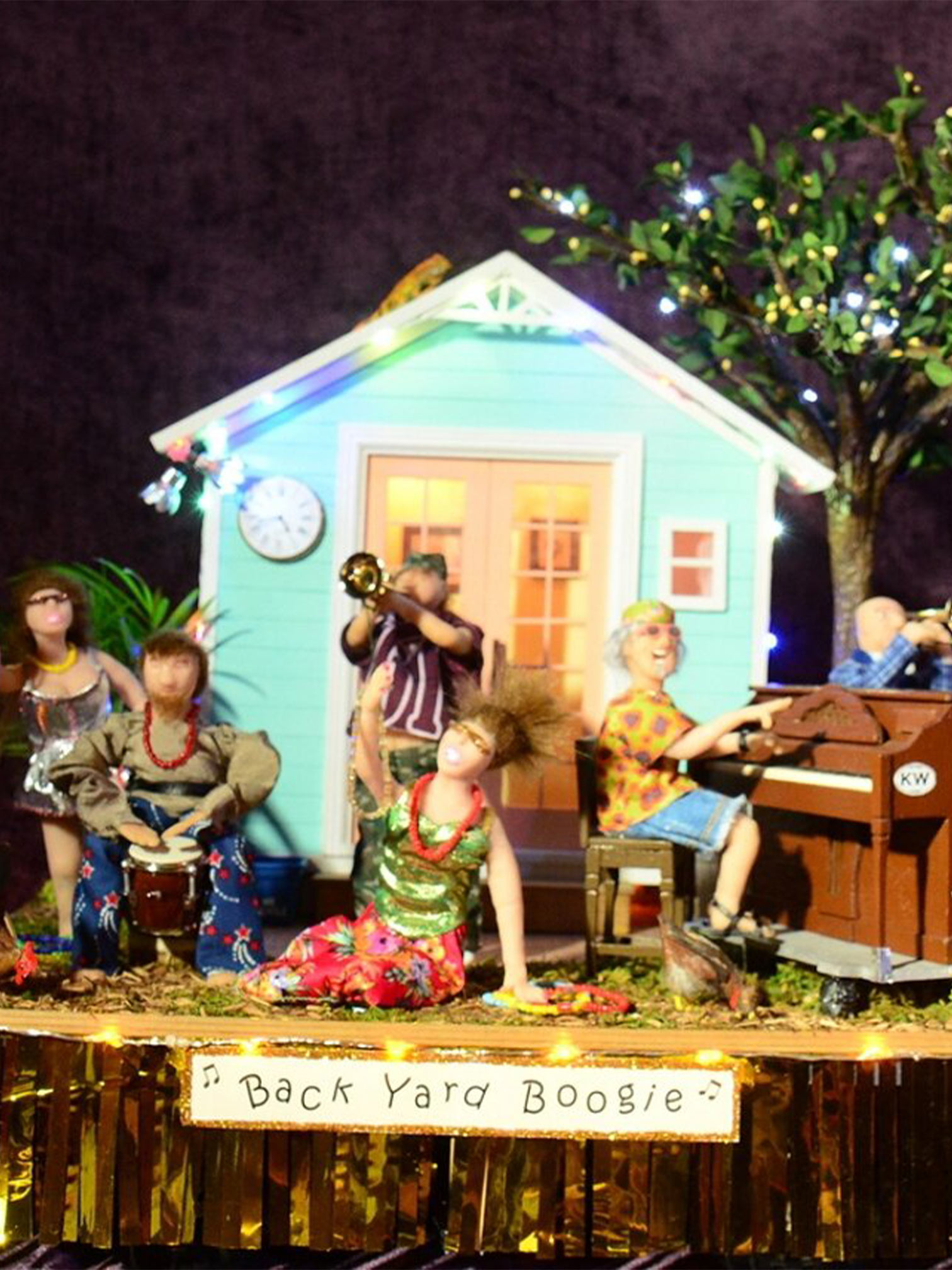 color photo 1st Place Smallest Parade winning float "Back Yard Boogie" musicians playing in house backyard