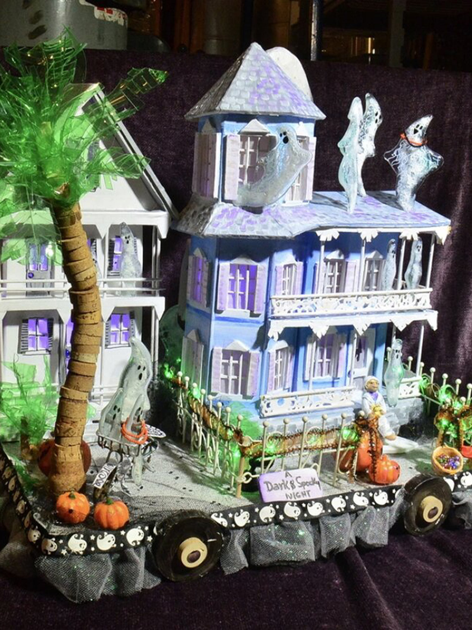 color photo of Smallest Parade "Dark and Spooky Night" float entry house with ghosts