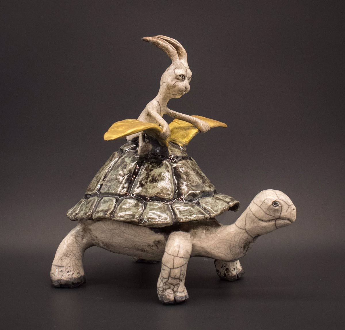Paola Effio raku sculpture of rabbit riding a turtle