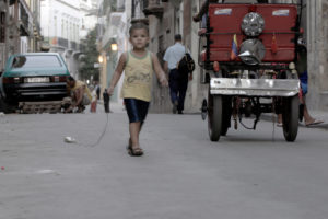 photo or small boy in urban street for Art of Documentary class given by Irina Patkanian, Artist in Residence