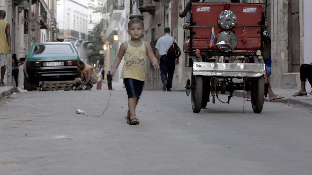 photo or small boy in urban street for Art of Documentary class given by Irina Patkanian, Artist in Residence