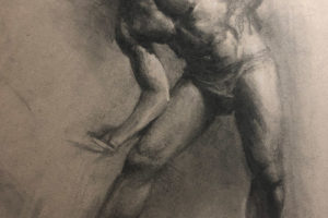 Charcoal figure drawing of a man.
