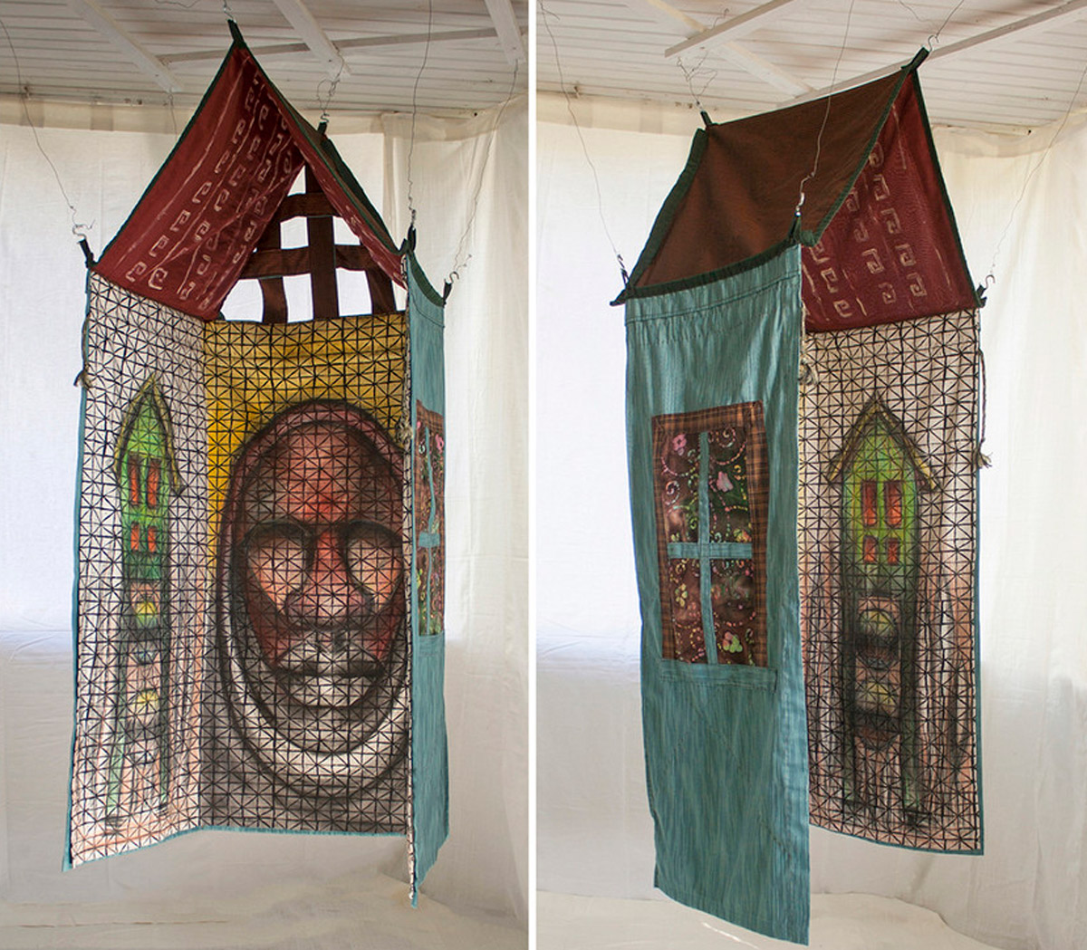 Two views of a quilt hanging in the shape of a house - with a man's face painted on the inside and red peaked roof.