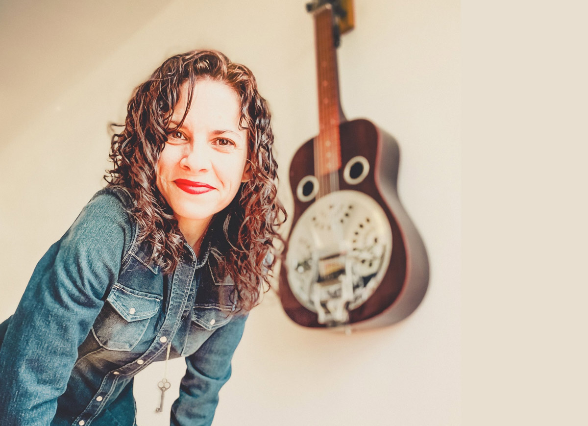 Abbie Gardner is a fiery dobro player with an infectious smile. Her live show is truly unique, showcasing her as a songwriter, captivating vocalist, and world-class lap style dobro player.