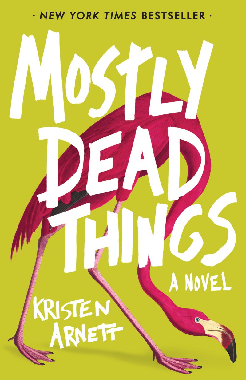 "Mostly Dead Things" written over a pink flamingo and yellow-green background