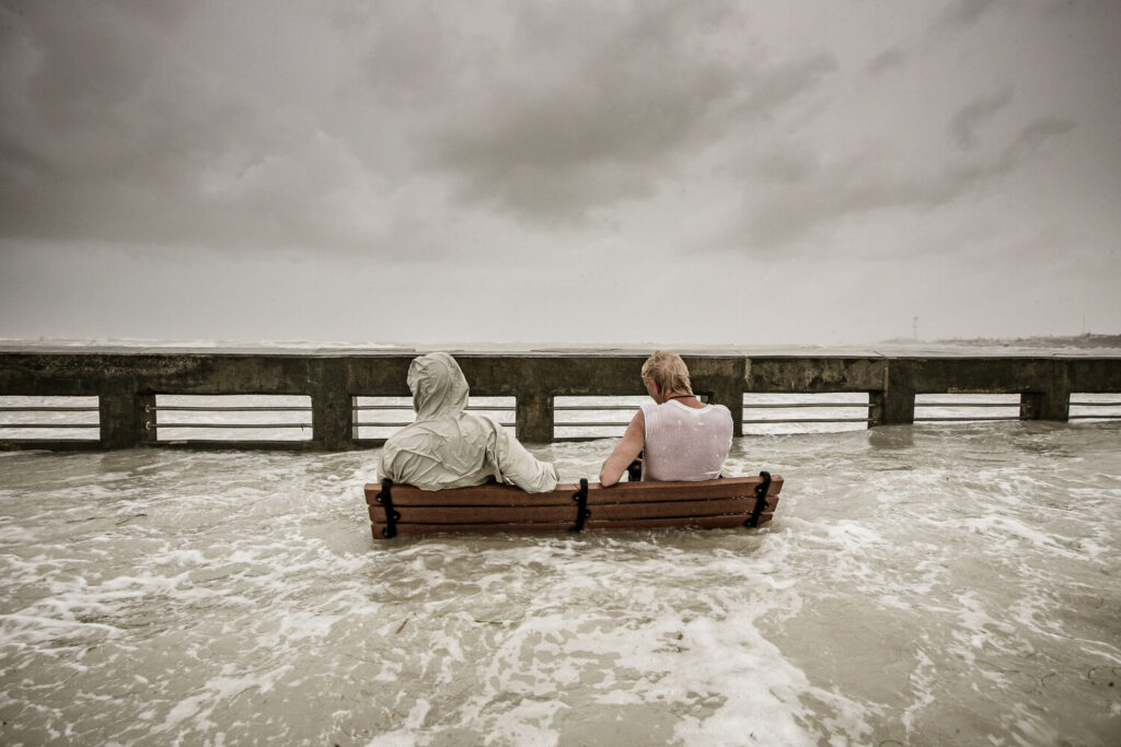 A coastal community is thrust into chaos when the government orders them to relocate due to climate change. Amidst the impending crisis, the community is torn between nostalgia, resilience, and the desire to protect what they hold dear.