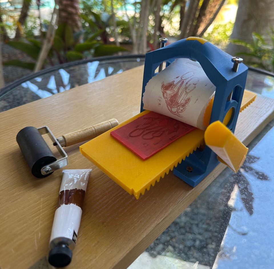Learn the basics of relief and intaglio printmaking with a DIY printing press. Get imaginative and scale it down with miniature prints on a miniature press!