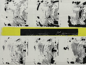 Minimalist artwork featuring circular black patterns resembling tree rings, with a horizontal yellow and black stripe cutting across the center.