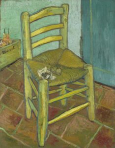 Famous Vincent van Gogh painting of a rustic yellow wooden chair with a woven seat, pipe and pouch resting on top, placed against a green-blue wall and tiled floor.