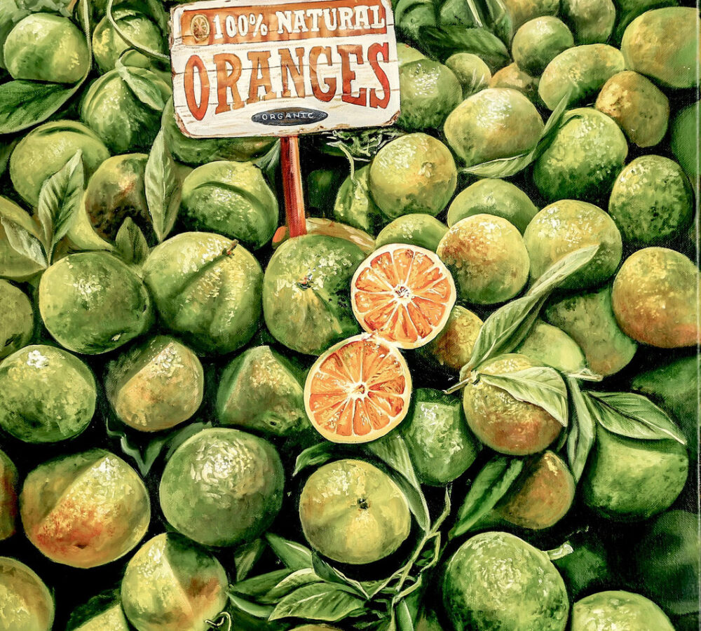 Realistic painting of a pile of green oranges with a wooden sign reading “100% Natural Oranges” and sliced fruit in the foreground.
