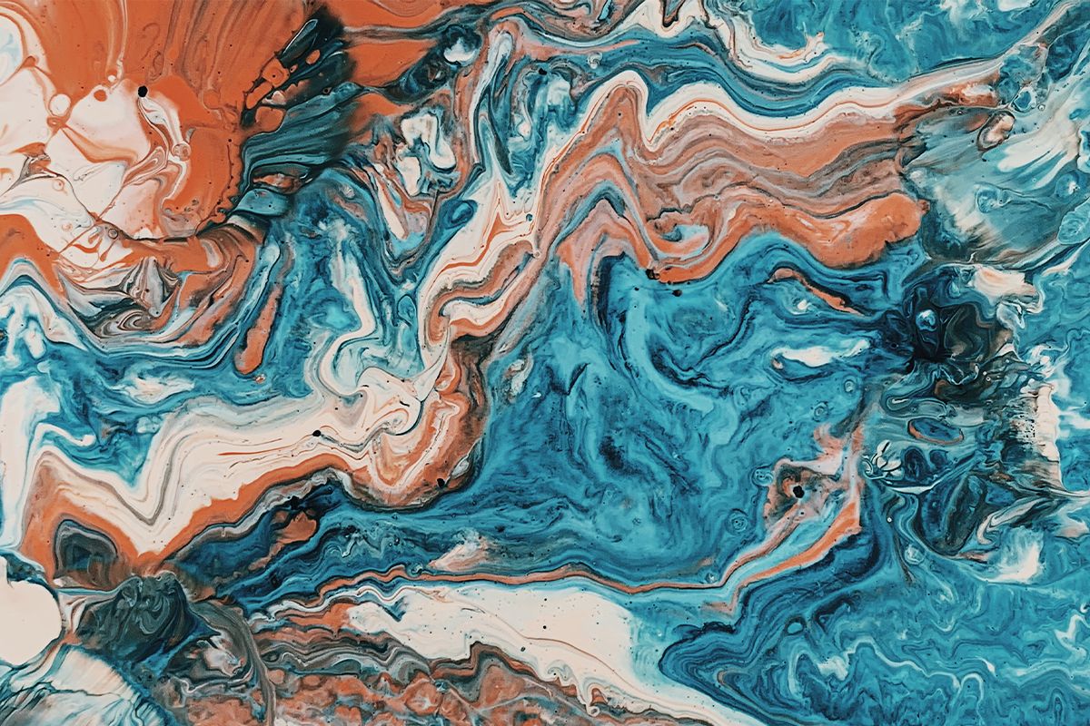 Close-up of an abstract acrylic pour painting with swirling shades of turquoise, white, and burnt orange.