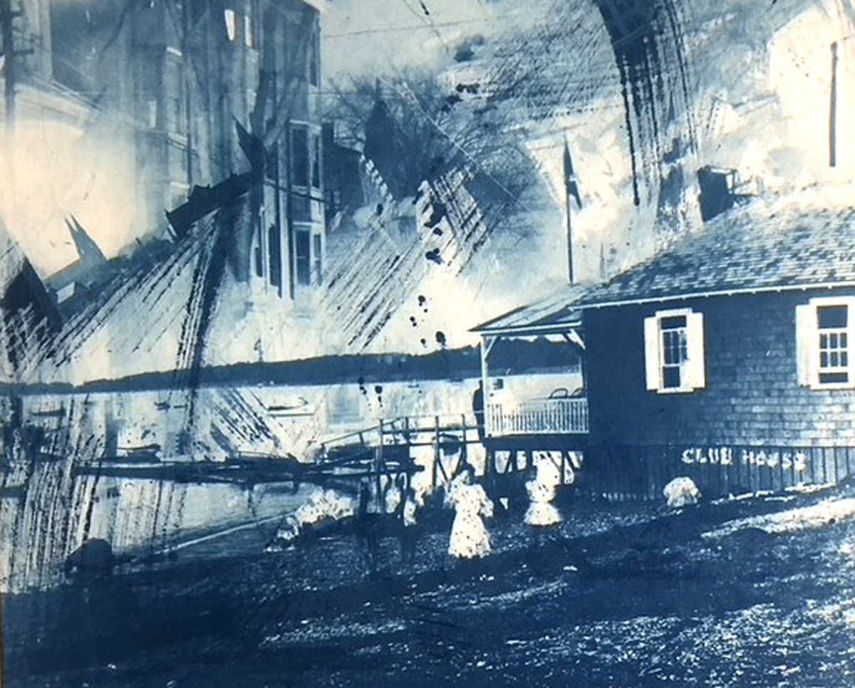 goldkin-cyanotype Cyanotype print in blue tones showing an old shingled clubhouse by the water, with ghostly layered textures and streaked brush marks evoking a vintage photograph.