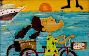 Whimsical painting of a woman riding a red bicycle by the ocean with signs reading “Hot and Chewy” and “Cookie Lady.”